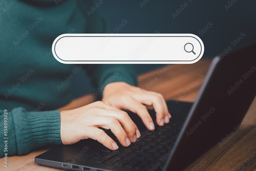 Fototapete Man's hand working with computer laptop on desk in home. Searching Browsing Internet Data Information with blank search bar. Search Engine Optimization SEO Networking Concept.