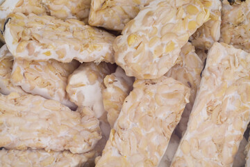 selective focus Raw tempeh or tempe. Tempe is a traditional Indonesian food made from fermented soybeans