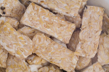 selective focus Raw tempeh or tempe. Tempe is a traditional Indonesian food made from fermented soybeans