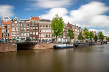 amsterdam canal long exposure with smooth water and clouds