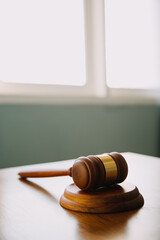 Obraz premium Business and lawyers discussing contract papers with brass scale on desk in office. Law, legal services, advice, justice and law concept picture with film grain effect