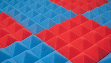 Acoustic foam panel background with red and blue lighting. Music background