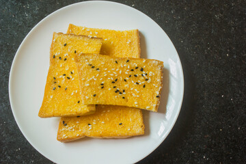 White sesame and black sesame biscuits in a white plate