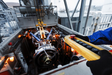 Yellow Remote control of a crane for installing a gas turbine plant for generating energy © Alexander