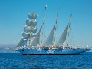 Fototapeta na wymiar Classic yacht under full sail in blue ocean