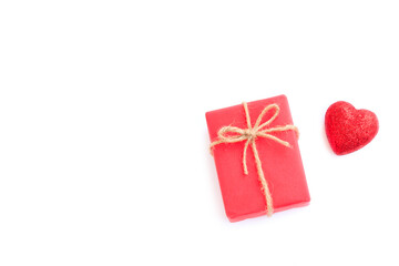 Red gift box with bow and Red glitter heart isolated on white background