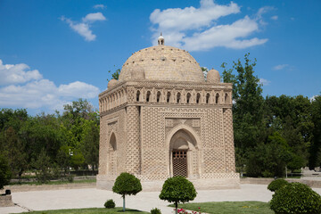 Samanid stone mausoleum in a park in Bukhara, Uzbekistan. Tourism, travel concept.