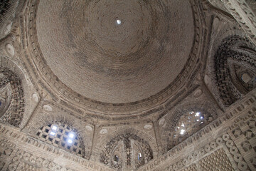 The interior of the stone mausoleum of the Samanids in Bukhara, Uzbekistan. Tourism, travel concept.