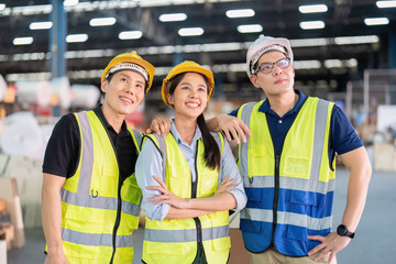 Staff in large storage warehouse together portrait after work completed hand on shoulder smiling