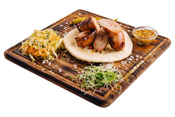 Delicious grilled sausages on a board with mustard sauce