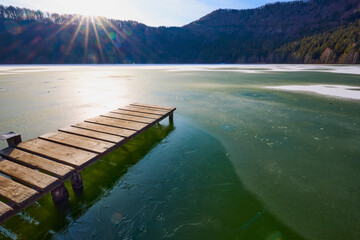 Beautiful landscape with St. Ana Lake in Romania, volcanic lake in December.