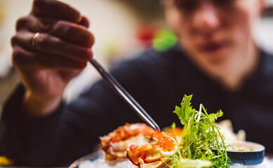 chef decorated plate with food on kitchen