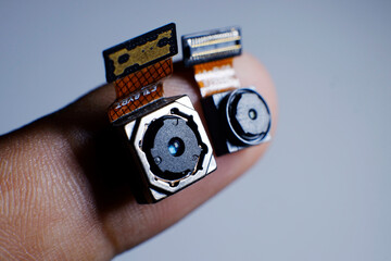 tiny small camera in hand for spy or hidden camera
