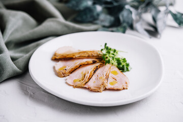 Sliced duck breast roasted meat on a plate