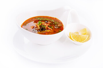 meat soup Solyanka in bowl isolated on white background