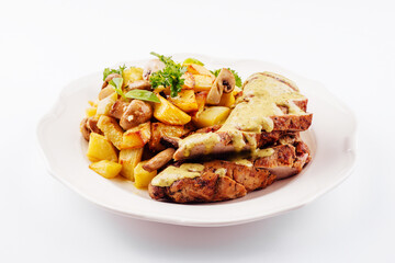 Plate with fried pork fillet, potato wedges, mushrooms