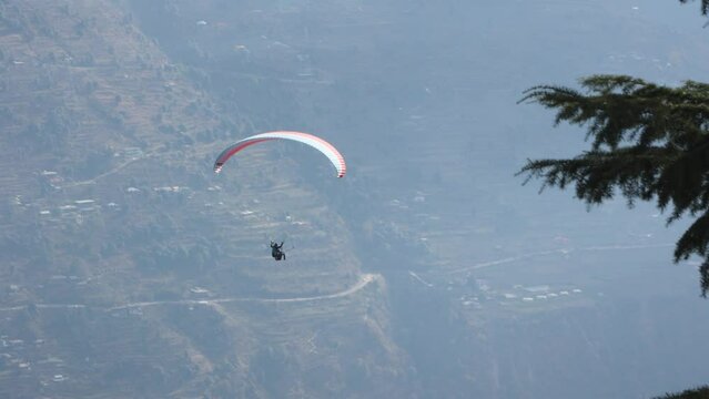 Paragliding at Solang Valley Kullu Manali Himachal Pradesh India. Beautiful Indian mountain in Himalayas.