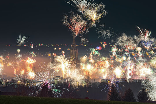 New year silvester firework in City Ulm Neu-Ulm in 2022. View from Eselsberg to the Minster