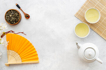 Japanese table setting with teapot and cups of tea