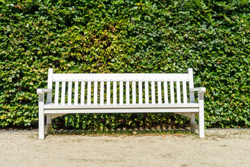 a white bench in the park