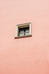 A window on pink wall