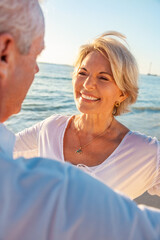 Happy Senior Retired Old Couple on a Beach - 558118815