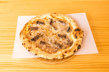 Pizza with oxtail stew with cheese baked in a stone oven