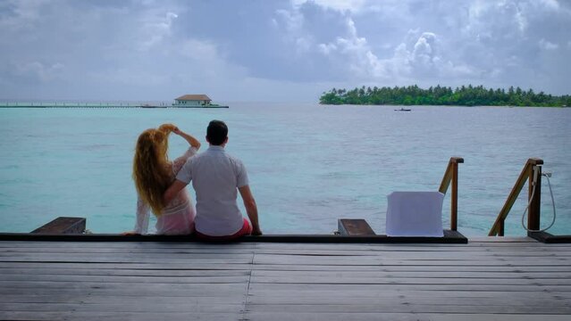 Couple is on a terrace. Summer travel vacation concept.