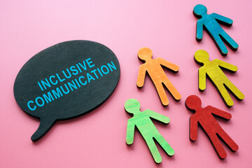 Inclusive communication inscription and small colorful figurines.