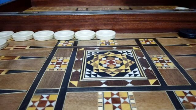 Timelapse of a backgammon Board game - closeup of a wooden backgammon board - Playing leisure games
