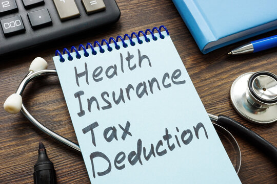 Open Notebook With Inscription Health Insurance Tax Deduction.