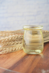 top view of wheat cooking oil bottle on table 
