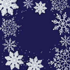 New Year's background. Snowflakes on a dark background with a scattering of snow grains.