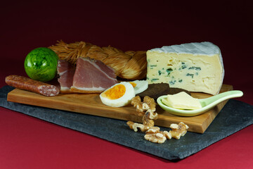 closeup image of a typical german easter breakfast with colored eggs and fluffy bread
