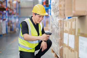 Staff working in large depot storage warehouse hold wireless barcode scanner scan box at shelf