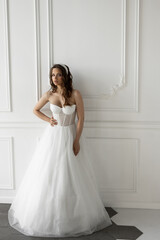 Fototapeta na wymiar stylish caucasian bride in white wedding dress