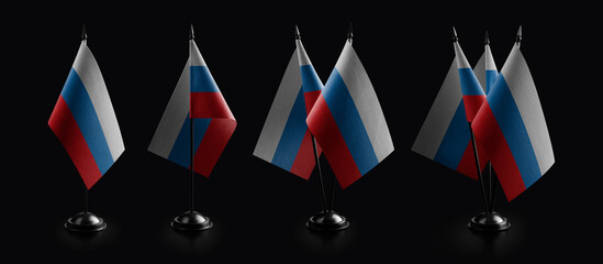 Small national flags of the Russia on a black background