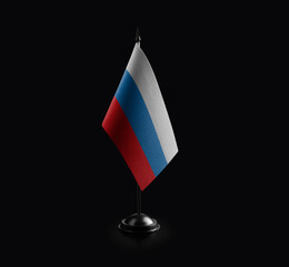 Small national flag of the Russia on a black background