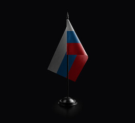 Small national flag of the Russia on a black background