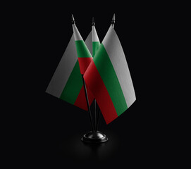 Small national flags of the Bulgaria on a black background