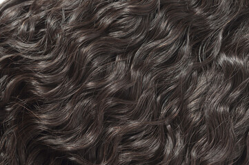 closeup of deep wave curly black human hair lace weaves extensions wigs