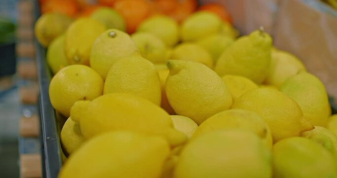 ripe lemons in fruit market, closeup view, healthy food and nutrition, 4K, Prores