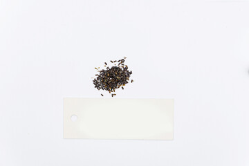 lavender seeds on a white background with a sign