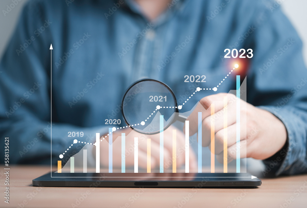 Poster businessman holding magnifier glass to find virtual increasing technical graph and up arrow for trad