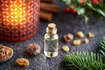 Aromatherapy essential oil with myrrh, frankincense, fir and holly