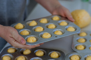 Brazilian traditional cheese buns are homemade snacks that are prepared and baked home