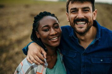 Portrait Of Happy Loving Couple With Man And Woman As They Hug In Autumn Together.