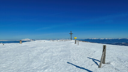 Hiking trail along a fence leading to the summit cross of mountain peak Ladinger Spitz, Saualpe,...