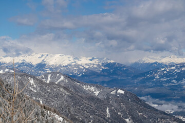 Panoramic view of the snowcapped mountain ranges of High Tauern and Nock Mountains seen from Kobesnock near Bad Bleiberg, Carinthia, Austria, Europe. Winter wonderland landscape in Austrian Alps