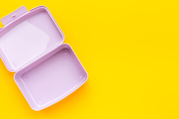 Empty plastic lunch box. Purple container for food, top view